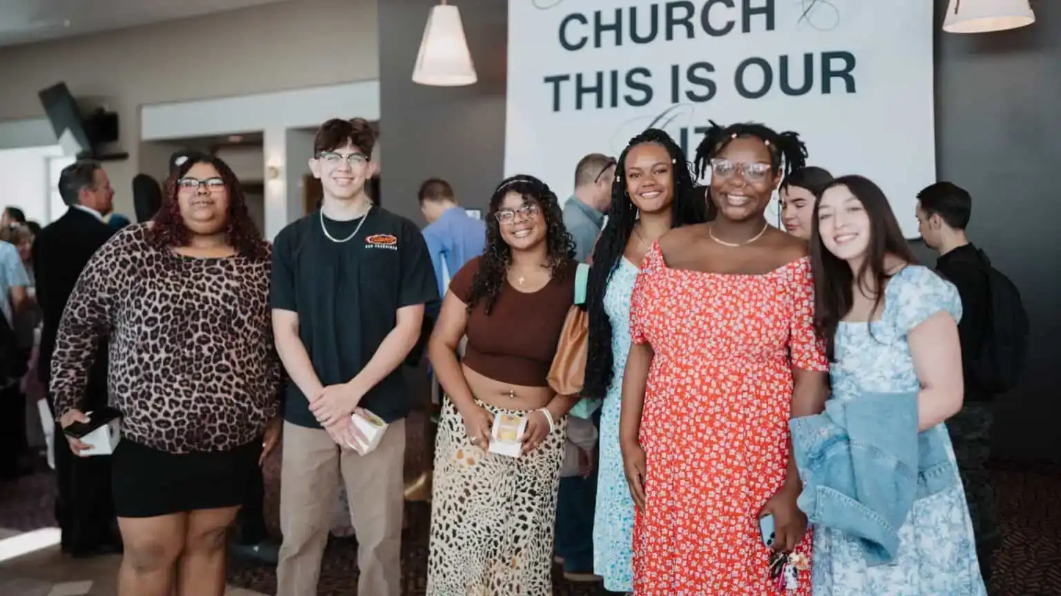 Young adults gathered at a Believer Church event