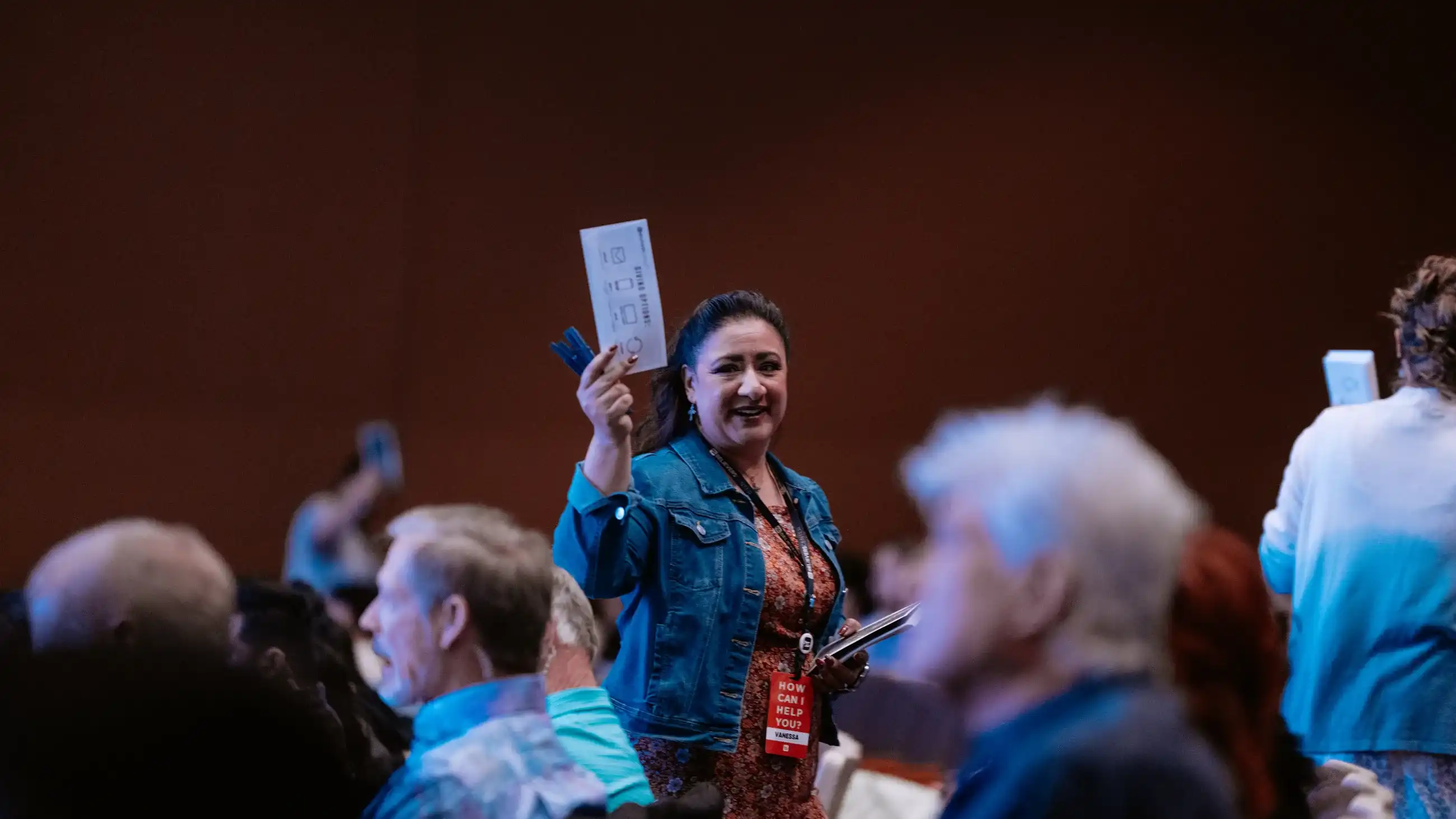 Serve team member greeting people during a Believer Church gathering