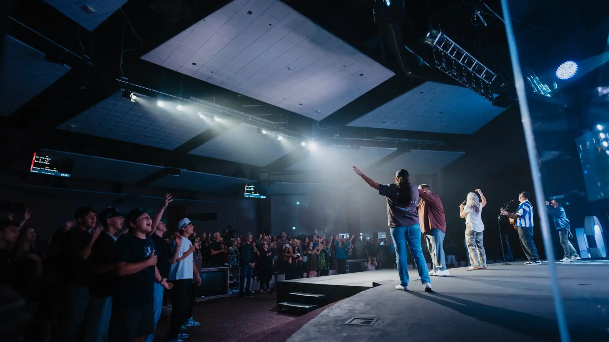 Worship team leading the congregation from the Believer Church stage