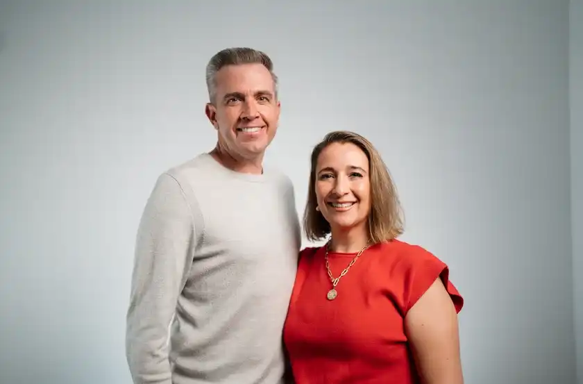 A smiling couple who lead a Believer Church small group