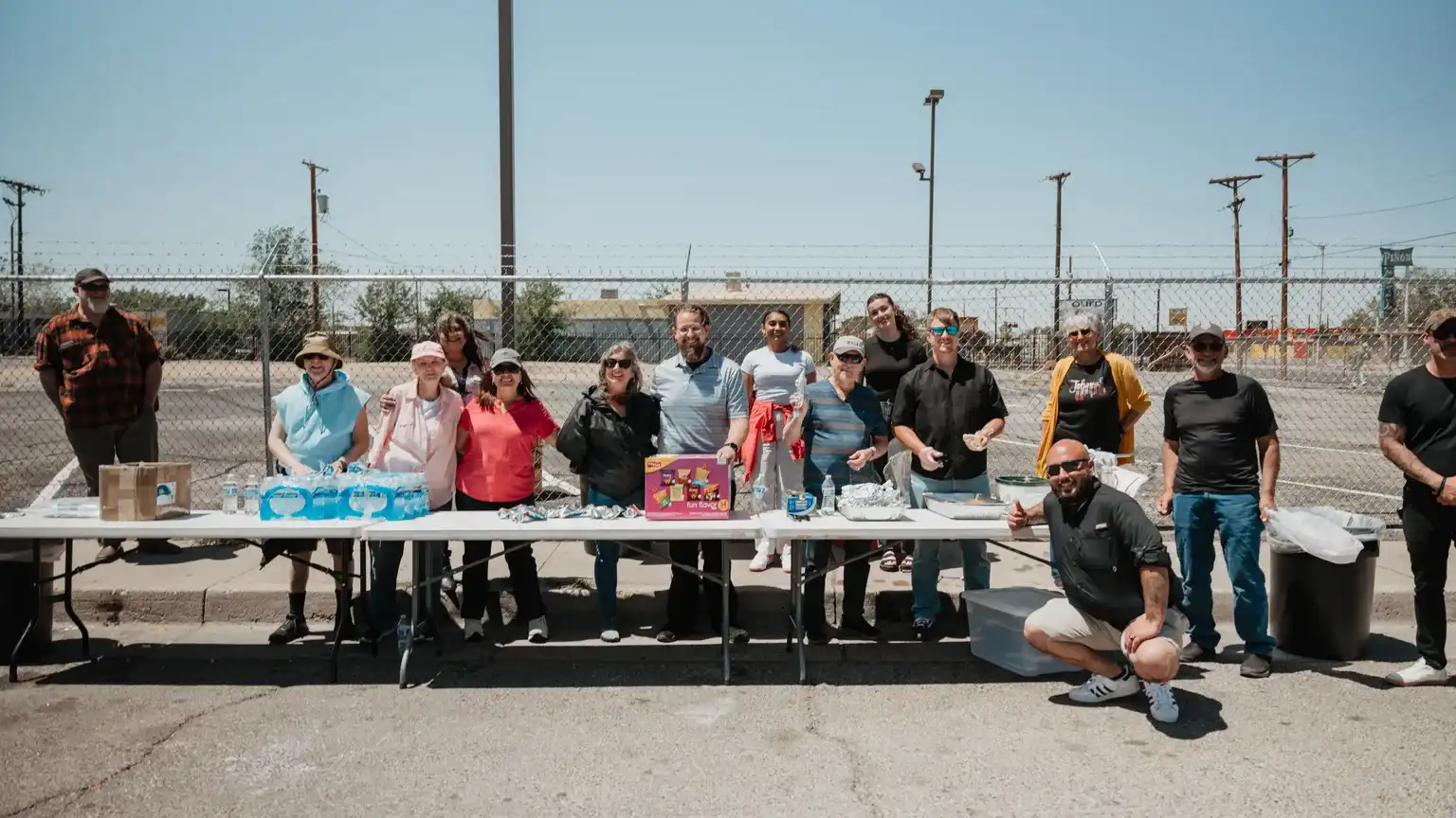 Love ABQ serve team standing behind tables of food and water