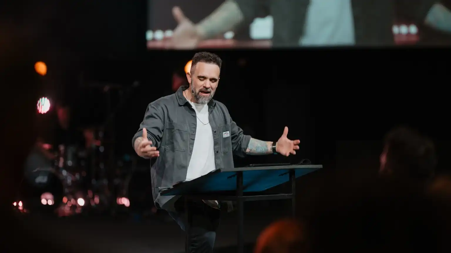 Pastor David Eiffert preaching at the lectern on a Sunday morning