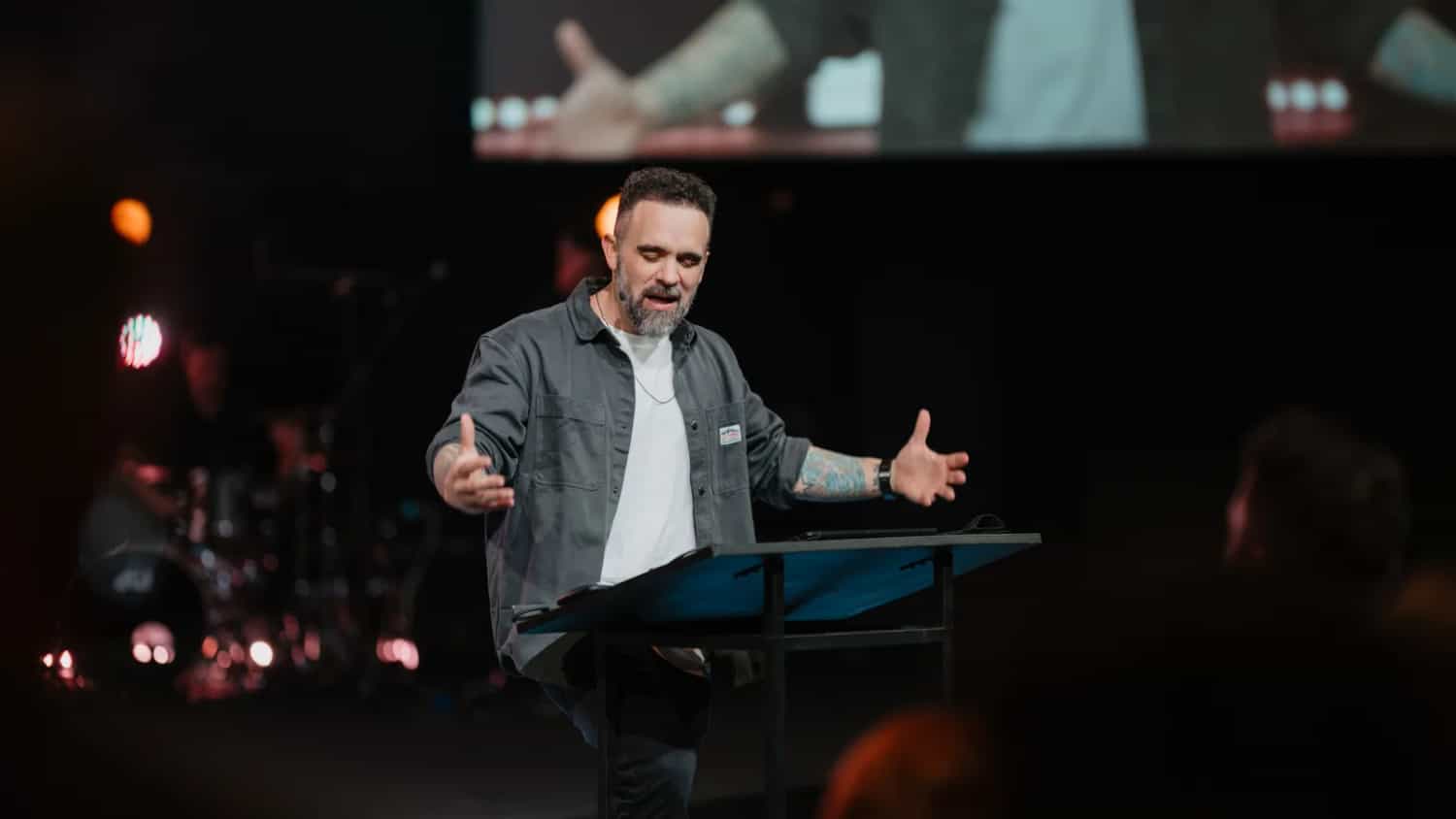 Pastor David Eiffert preaching at the lectern on a Sunday morning